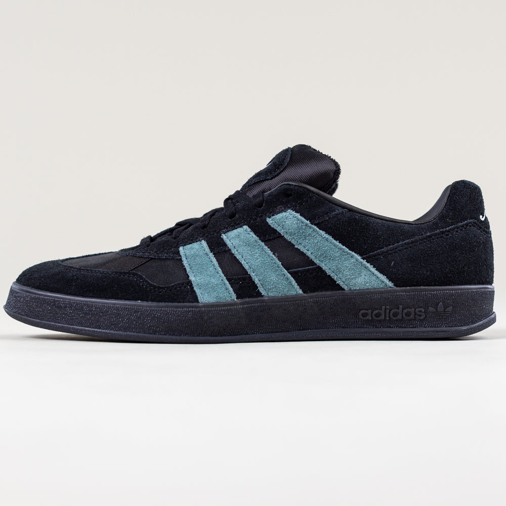 The JQ1042 Black Prete Aloha Super Suede Leather Skateboarding Shoes by Adidas feature light blue stripes and offer excellent board control, showcased in a side profile view against a plain, light background.