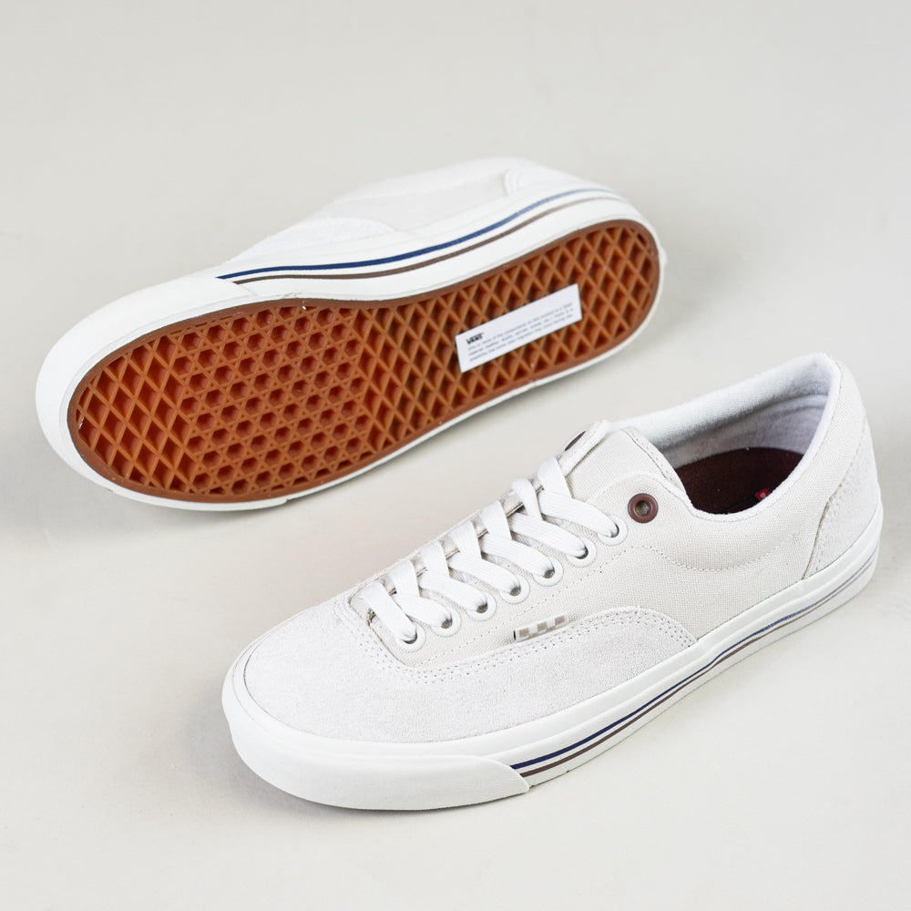 A pair of VN000DA3TUP1 Dime Skate Era Stub Taupe Vans Suede Skateboarding Shoes with white laces, white soles, and a gum-colored waffle-textured outsole. One shoe is upright; the other shows the sole.