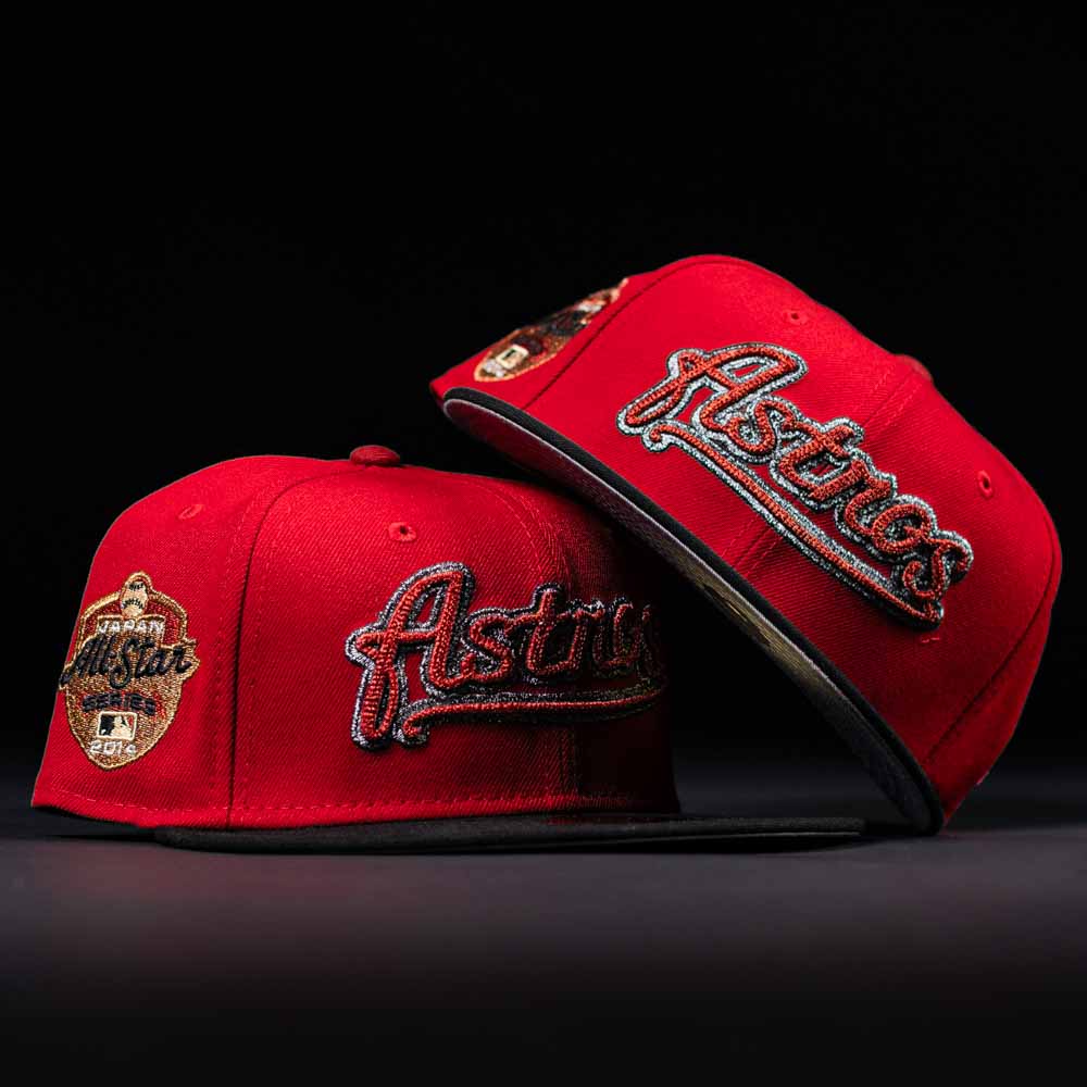 Two Samurai Japan ASG Houston Astros New Era Hat 5950 Fitted in red feature bold embroidered team logos and a gold 2016 MLB All-Star Game patch on the side, displayed against a black background.