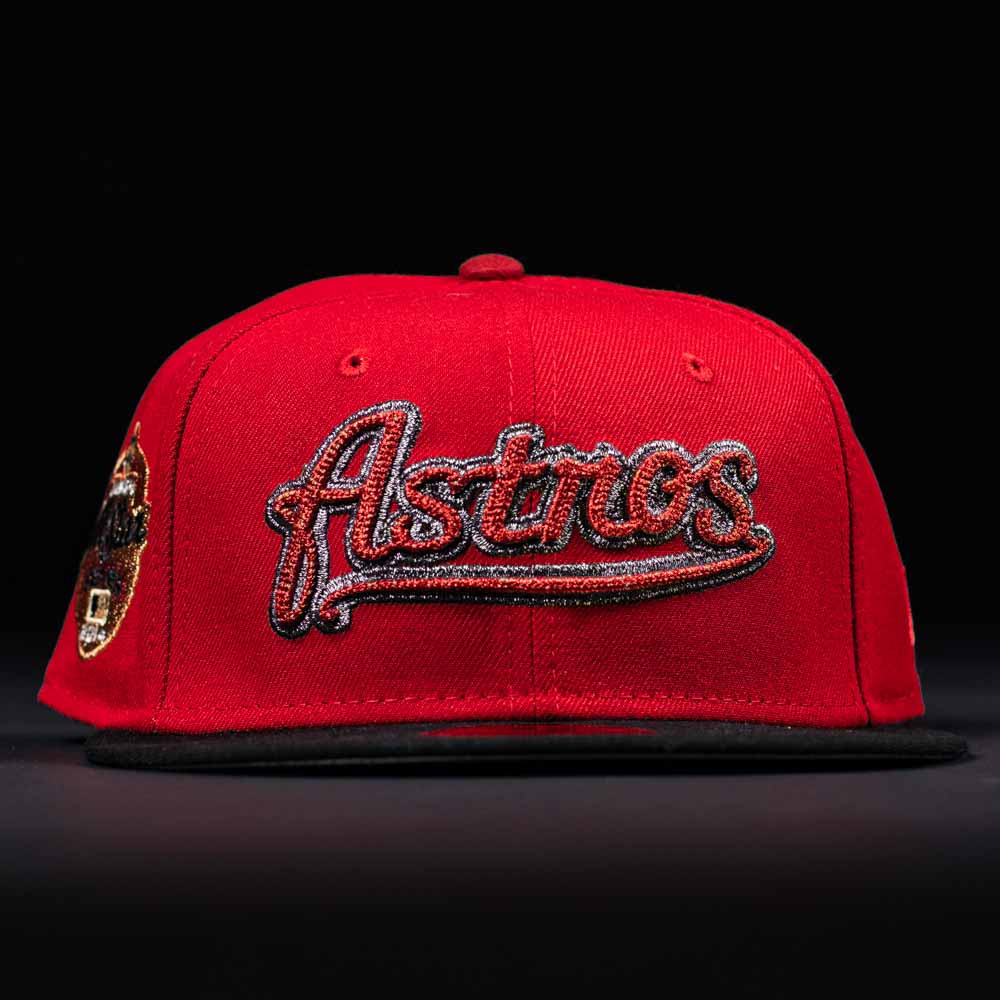 The Samurai Japan ASG Houston Astros New Era 5950 Fitted Hat features “Astros” in bold script on the front, a red crown, black brim, and a decorative patch on the left—perfect for any Houston Astros fan.