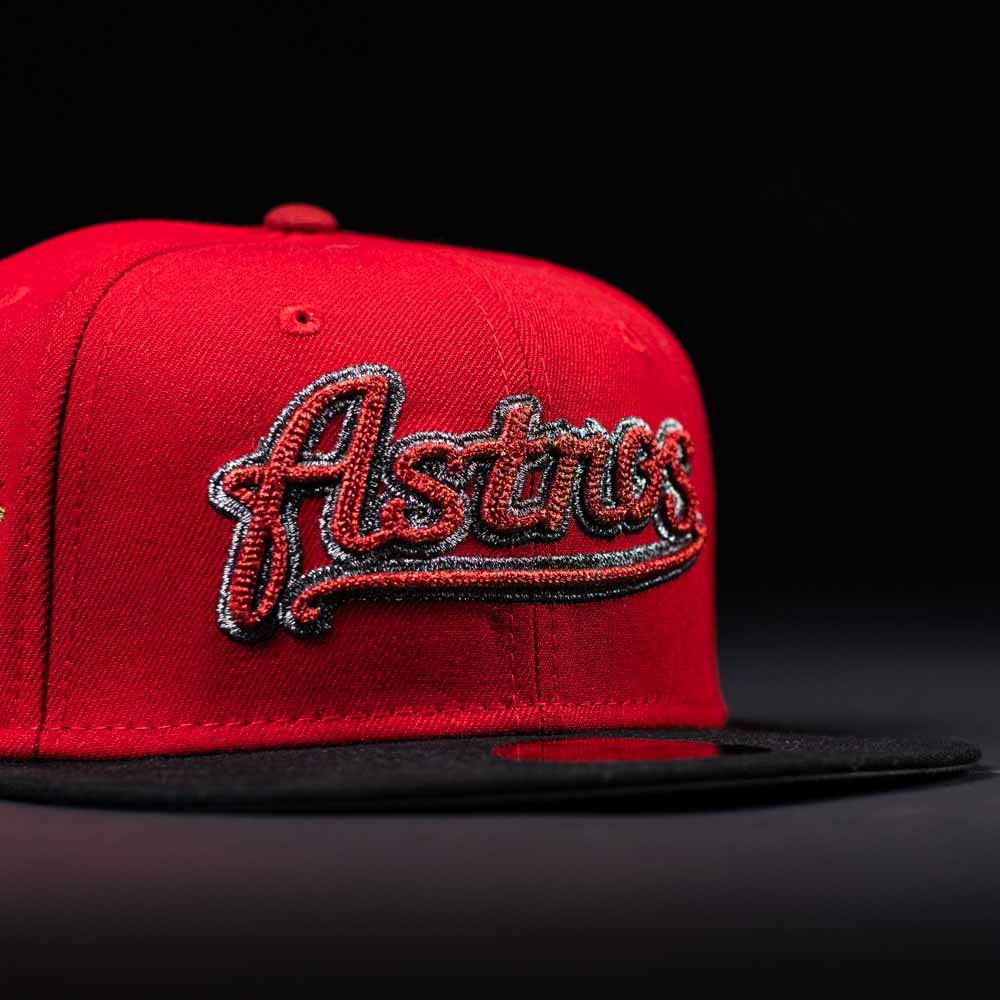 The Samurai Japan ASG Houston Astros New Era 5950 Fitted Hat features a red crown, black brim, and bold "Astros" script on the front, set against a dark background.