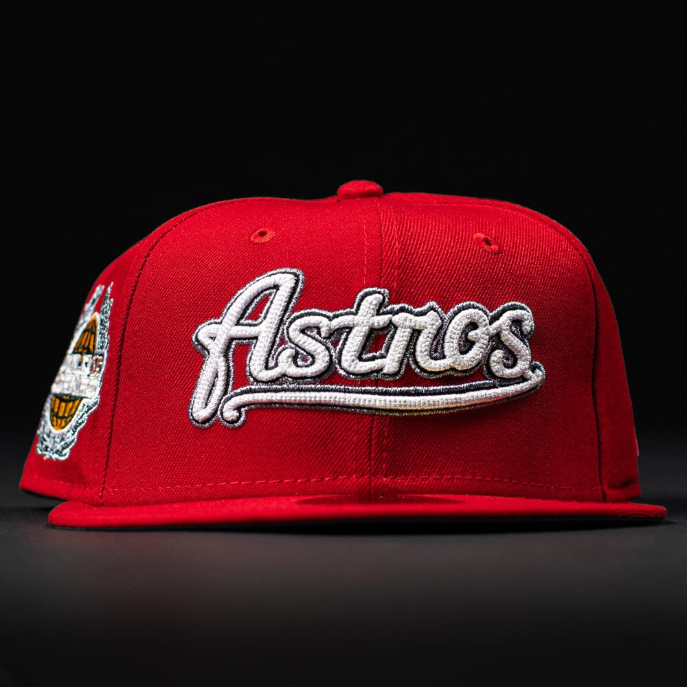 The Sunnyside Bo Bundy WS05 Houston Astros New Era 5950 Fitted Hat features bold white “Astros” script on the front, a colorful side patch, and a red design that stands out against black backgrounds.