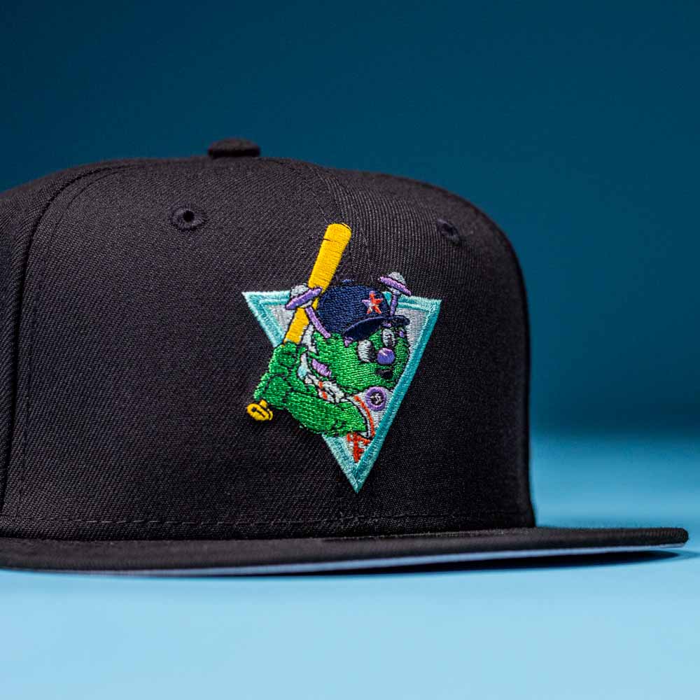 The Flamingo and Chill Bo Bundy 2022 Houston Astros New Era 5950 Fitted Hat features a colorful embroidered green cartoon character with a yellow bat on a blue triangle—ideal for Astros fans seeking standout style.