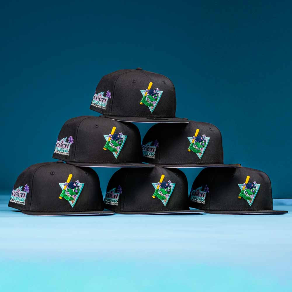 Six Flamingo and Chill Bo Bundy 2022 Houston Astros New Era Hat 5950 Fitted caps are stacked pyramid-style against a blue background, each featuring a vibrant, colorful embroidered patch on the front left panel.