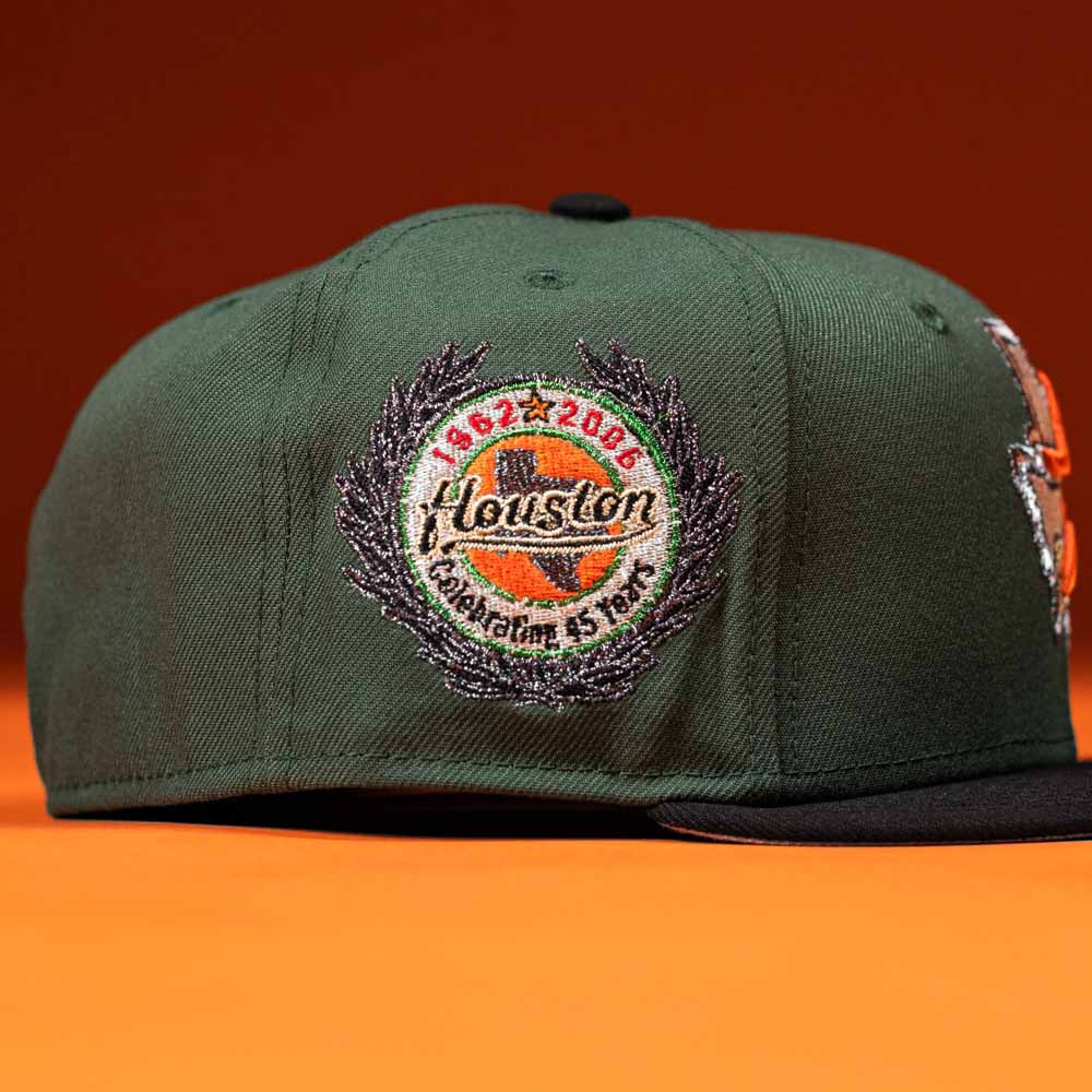 The El Jager Mountain Orange New Era Hat 5950 Fitted features a colorful embroidered patch and stands out with its bold orange color.