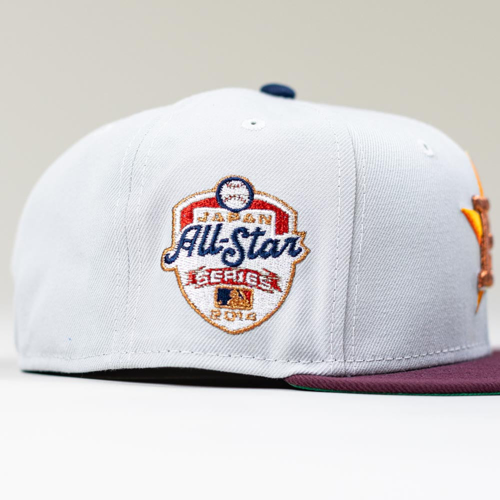 The Shibuya Lights New Era Silver Japan Houston Astros 5950 Fitted Hat features an embroidered Japan All-Star Series 2014 patch with a baseball graphic and colorful side details.