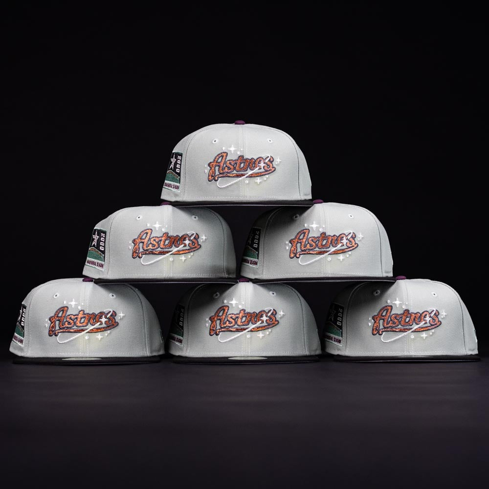 Six Pixie Dust New 2000 Houston Astros New Era Hat 5950 Fitted caps in light gray are arranged in a pyramid against a black background, each featuring side embroidered patches.