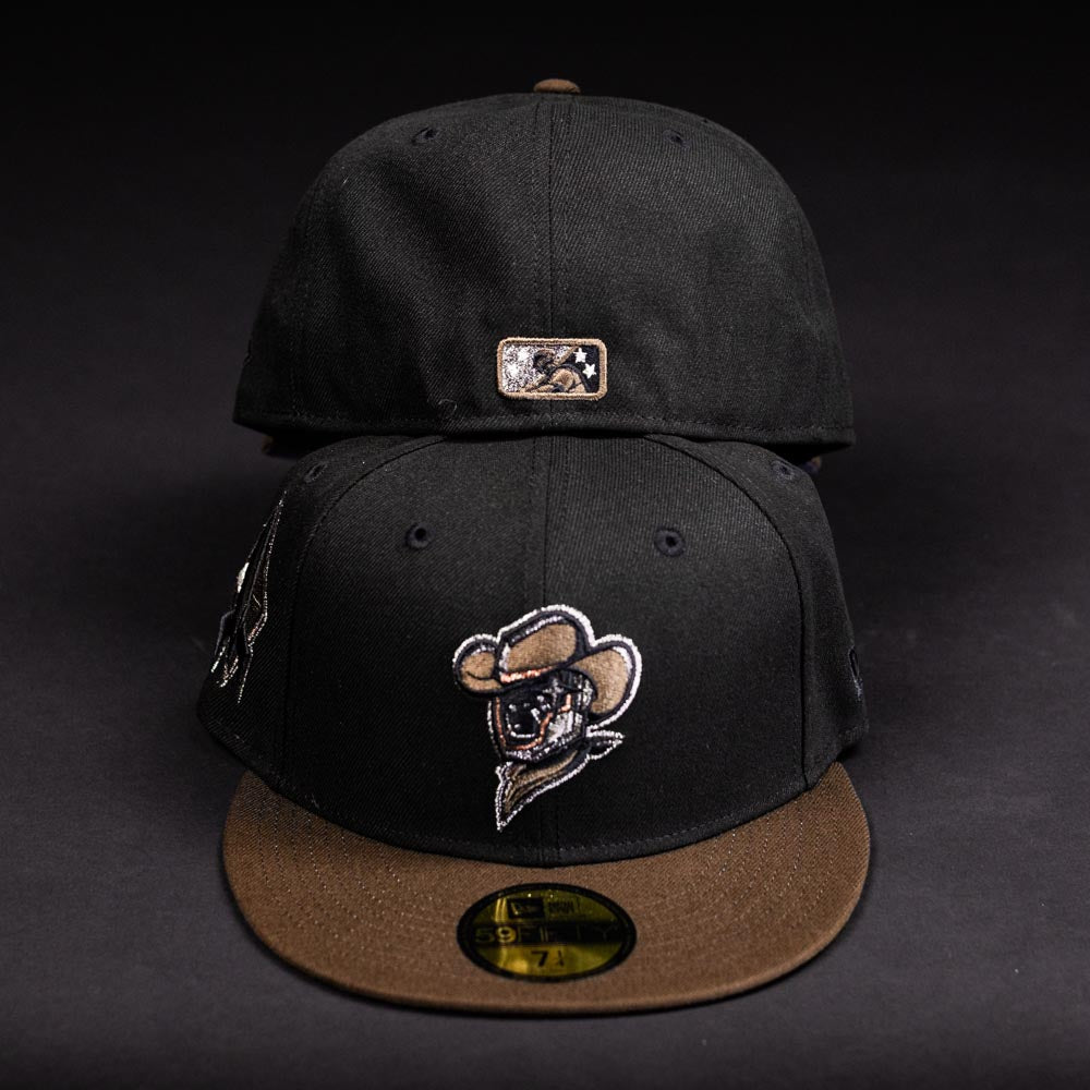 Two Midnight Cowboy Sugarland Space Cowboys New Era Hat 5950 Fitted caps are shown: one forward with the team logo, and one backward revealing a small patch. Both hats have flat brims and Black Walnut coloring.