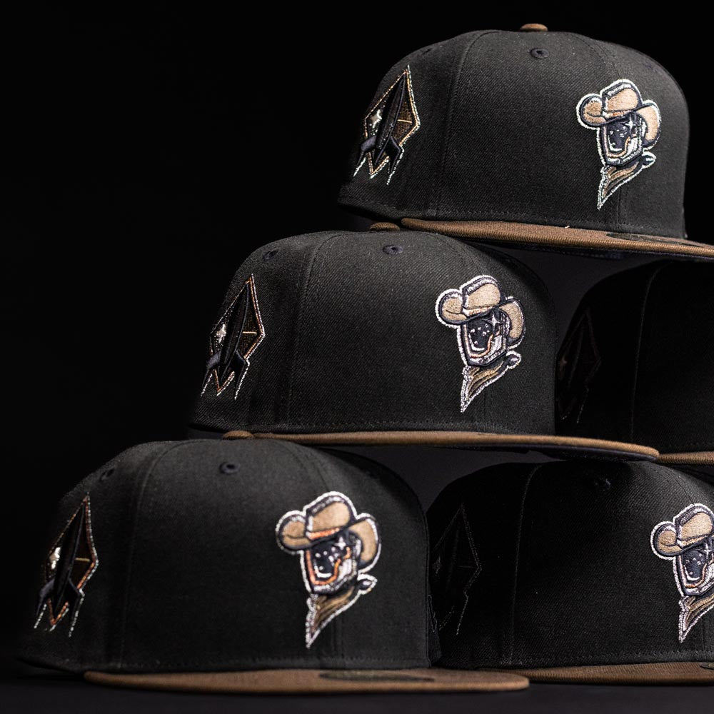 Five Midnight Cowboy Sugarland Space Cowboys New Era Hat 5950 Fitted caps with brown brims are stacked in a pyramid, each featuring embroidered Space Cowboys mascot and geometric logos on a sleek black background.