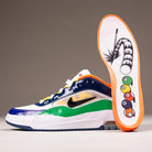 The HV1670600 University Red Black Amarillo Navy Air MAX Ishod Nike SB Suede Leather Skateboarding Shoe features vibrant blue, green, yellow, and orange accents, and its sole displays a cue stick hitting pool balls with Max Air cushioning.