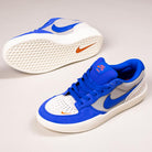 A pair of Nike SB Force 58 Suede Skateboarding Shoes (DV5477-011) in College Grey, Racer Blue, and Light Orewood with orange Swoosh, blue laces, and a textured white sole—fusing basketball heritage with cupsole skate design.