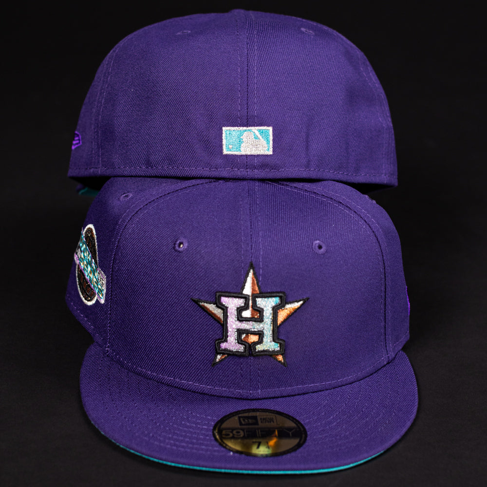 Two DAY N HOU Rushmore WS05 Purple Teal Houston Astros New Era 5950 Fitted hats are displayed. The front has the Astros star H logo and a side patch, the back features the MLB logo. Both hats appear against a black background.