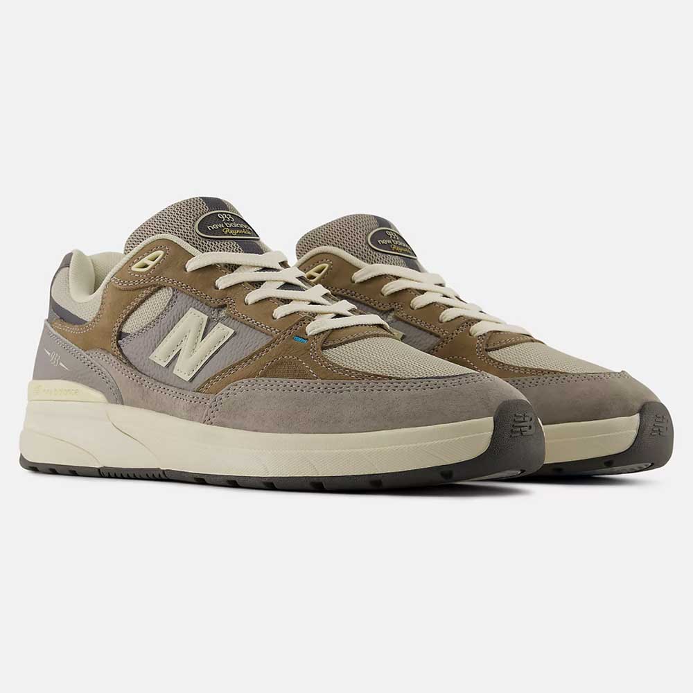 The 933 GRY Andrew Reynolds Gray Day New Balance Numeric Suede Skateboarding Shoes feature gray suede and mesh panels, cream laces, premium cushioning, the signature N logo on the side, and a beige and black rubber sole.