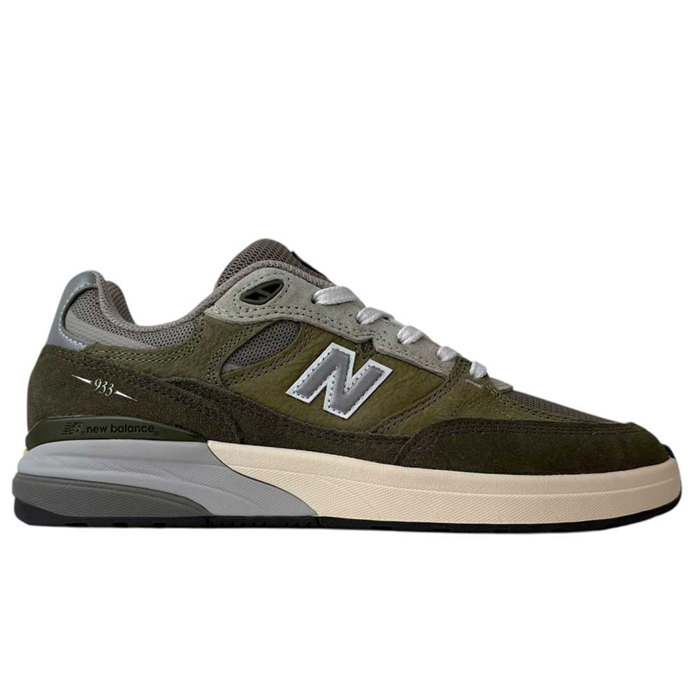 Side view of the 933 JKL Andrew Reynolds Grey Day New Balance Numeric Skateboarding Shoes, featuring olive green and dark brown suede, gray accents, cream midsole, black outsole, and a silver N logo—built for durability.