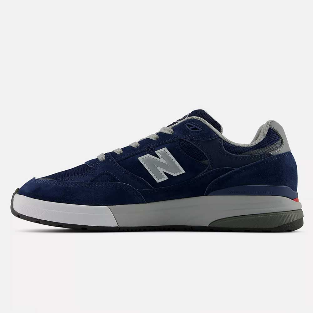 933 LNV Navy Slate Gray Andrew Reynolds New Balance Numeric Suede Skateboarding Shoes featuring a navy blue suede upper with slate gray and white accents, a white “N” logo on the side, and a white and gray rubber sole. Designed for skateboarding with premium cushioning for all-day comfort, this heritage-inspired sneaker is shown in a side profile against a plain background.