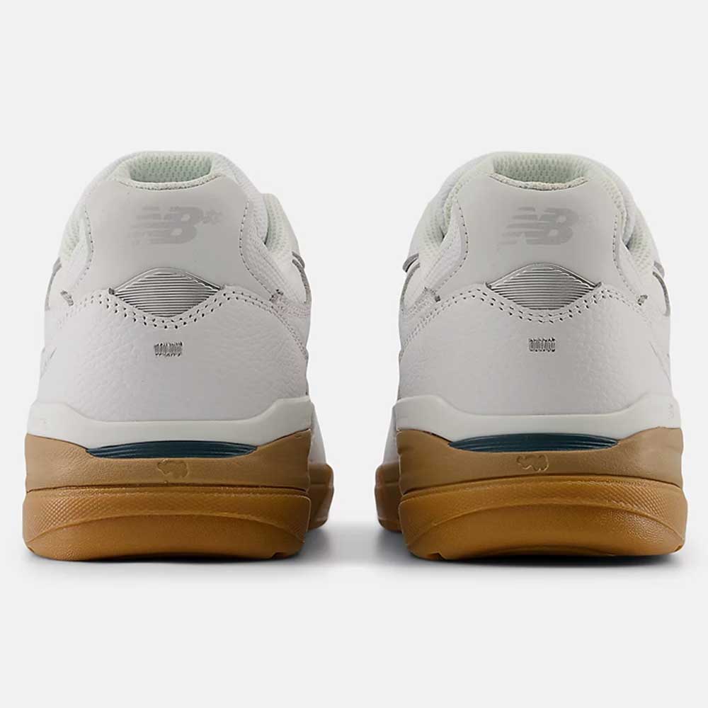 Rear view of 933 WWB White Black Andrew Reynolds New Balance Numeric Suede Skateboarding Shoes with gum soles, displaying the New Balance logo on the heels against a plain white background.