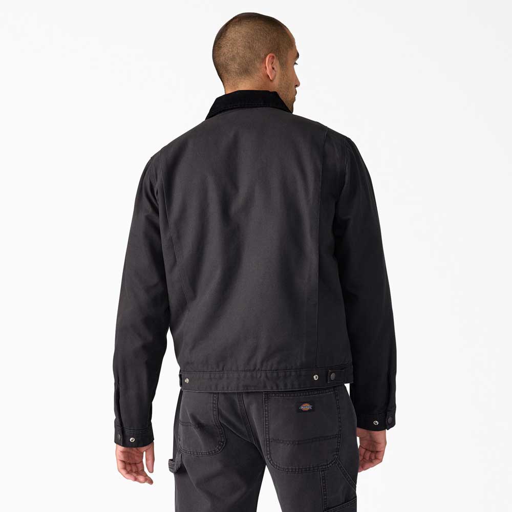 A person with short hair, seen from behind, is wearing the A8702 Black Blanket Lined Painter Canvas Jacket Dickies Skateboarding and matching black pants against a plain white background.