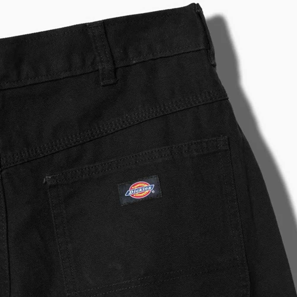 Close-up of the upper back of the A87PE Black Double Knee Canvas Carpenter Pant from Dickies Skateboarding, featuring a rectangular pocket with logo patch above, belt loop, visible seam, and classic workwear style.