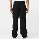 A person is shown from the back wearing A87PE Black Double Knee Canvas Carpenter Pant Dickies Skateboarding, featuring a baggy fit, large side pockets, and a logo patch above the right back pocket, paired with a white t-shirt against a light background.