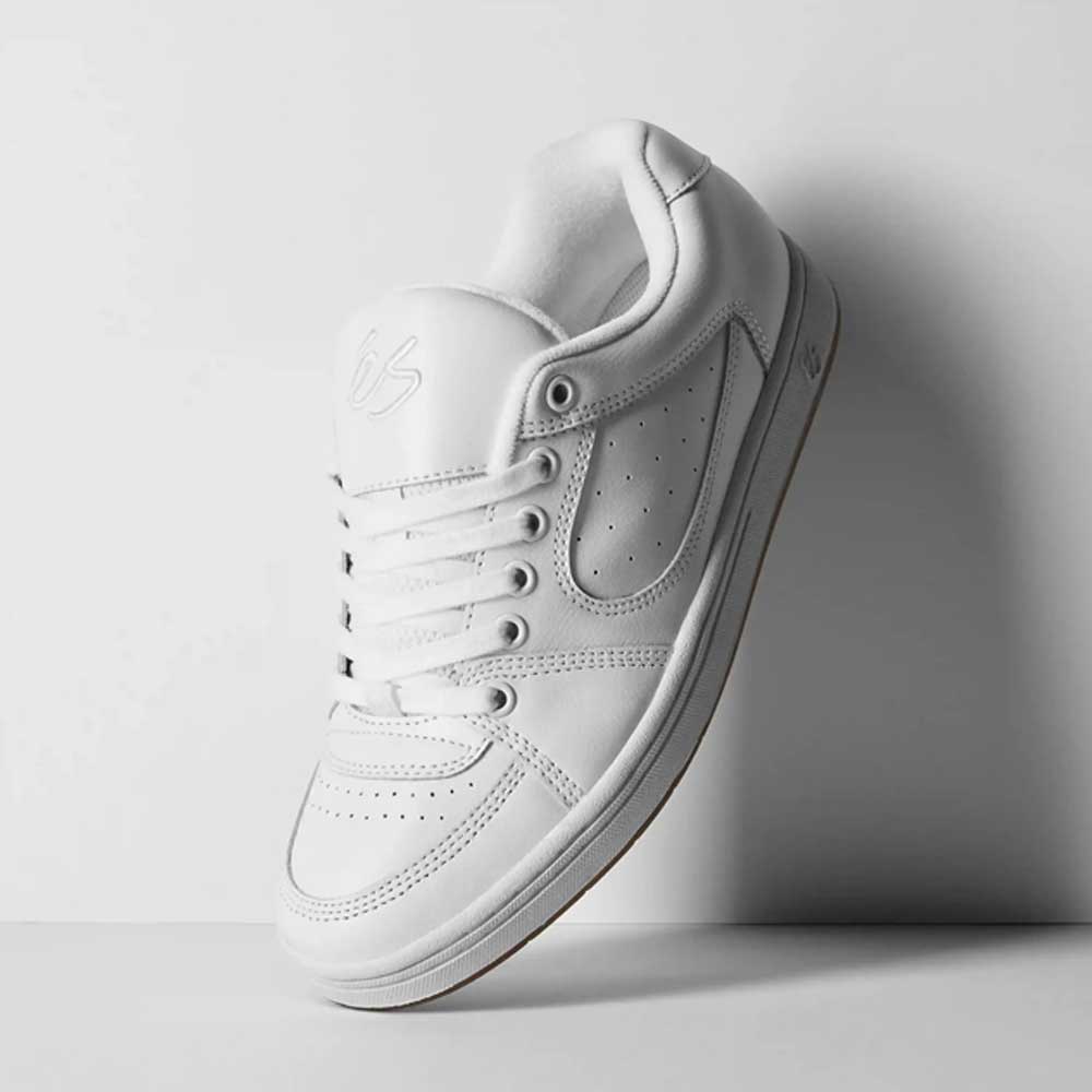 The Accel White Leather Es Shoes Skateboarding is a white low-top skate shoe with perforated details and white laces, shown upright on a plain white background, inspired by the classic éS Accel—ideal for skateboarding.