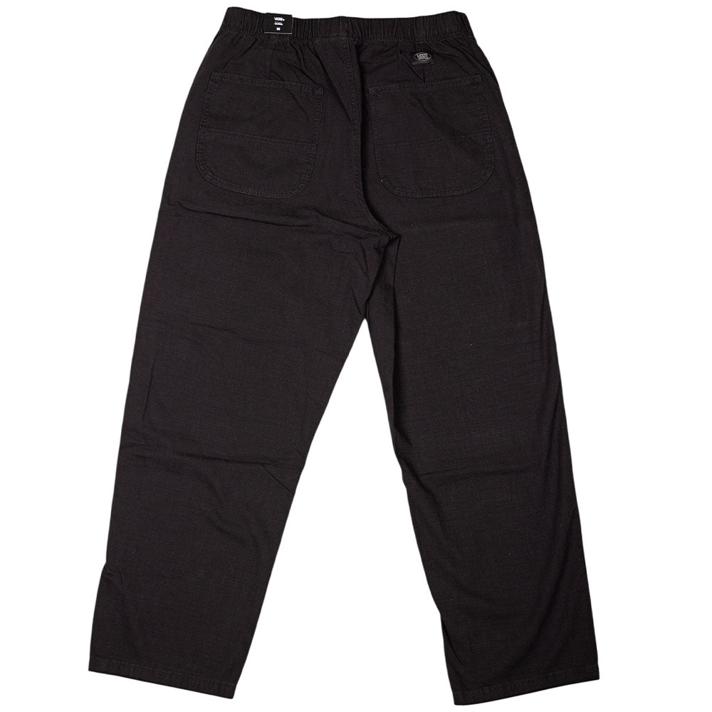 The Vans Addison Barrel Black VN0010HYBLK Pants feature a loose fit, two large back pockets, an elastic waistband, and are crafted from durable micro ripstop fabric. Shown here laid flat on a white background.