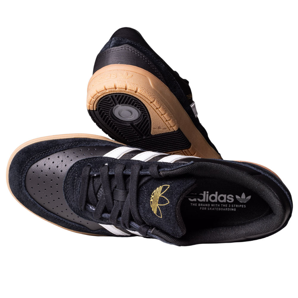 A pair of Adidas Tyshawn 2 II HQ4734 Black White Gum Skateboarding Shoes, featuring white stripes, a textured tan sole, and a responsive Lightstrike midsole—one shoe laying flat and the other propped to showcase the details.