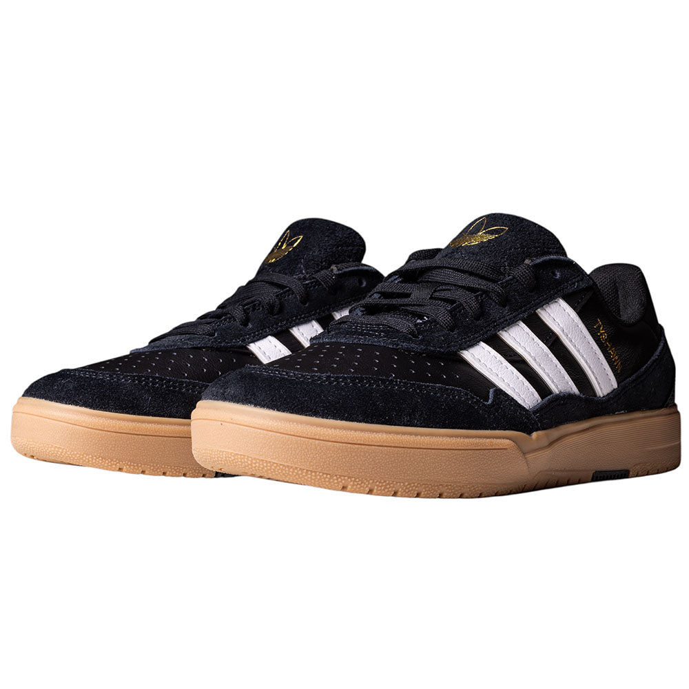 A pair of Black White Gum Tyshawn 2 II HQ4734 Adidas Skateboarding Shoes with white stripes, gold accents, premium leather uppers, and light brown rubber soles with a Lightstrike midsole, displayed on a white background.