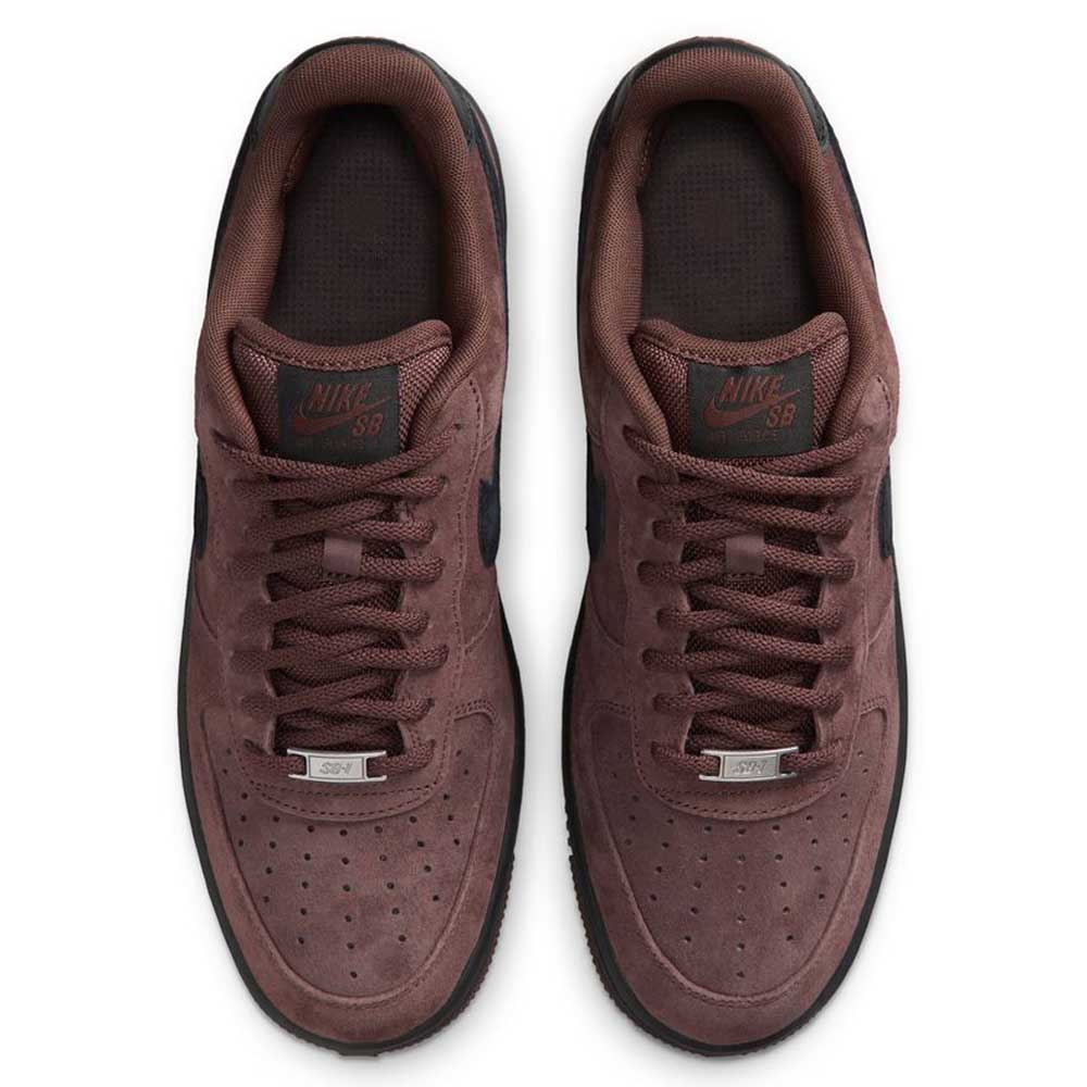 A pair of Air Force 1 Black Light Chocolate HM8517201 Nike SB suede skateboarding shoes are viewed from above, highlighting their laces, perforated toe boxes, and Nike SB logos on the tongues. Inspired by the classic Nike SB Air Force 1 design, these premium skate shoes also feature signature Nike Air cushioning for all-day comfort.
