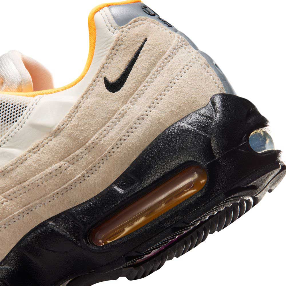 Close-up of the Air Max 95 Sail Black Laser Orange Nike SB Skateboarding Shoes (IQ8395100) featuring a visible Air Max sole, black Nike swoosh, orange inner lining, and textured black outsole for optimal skateboarding grip.