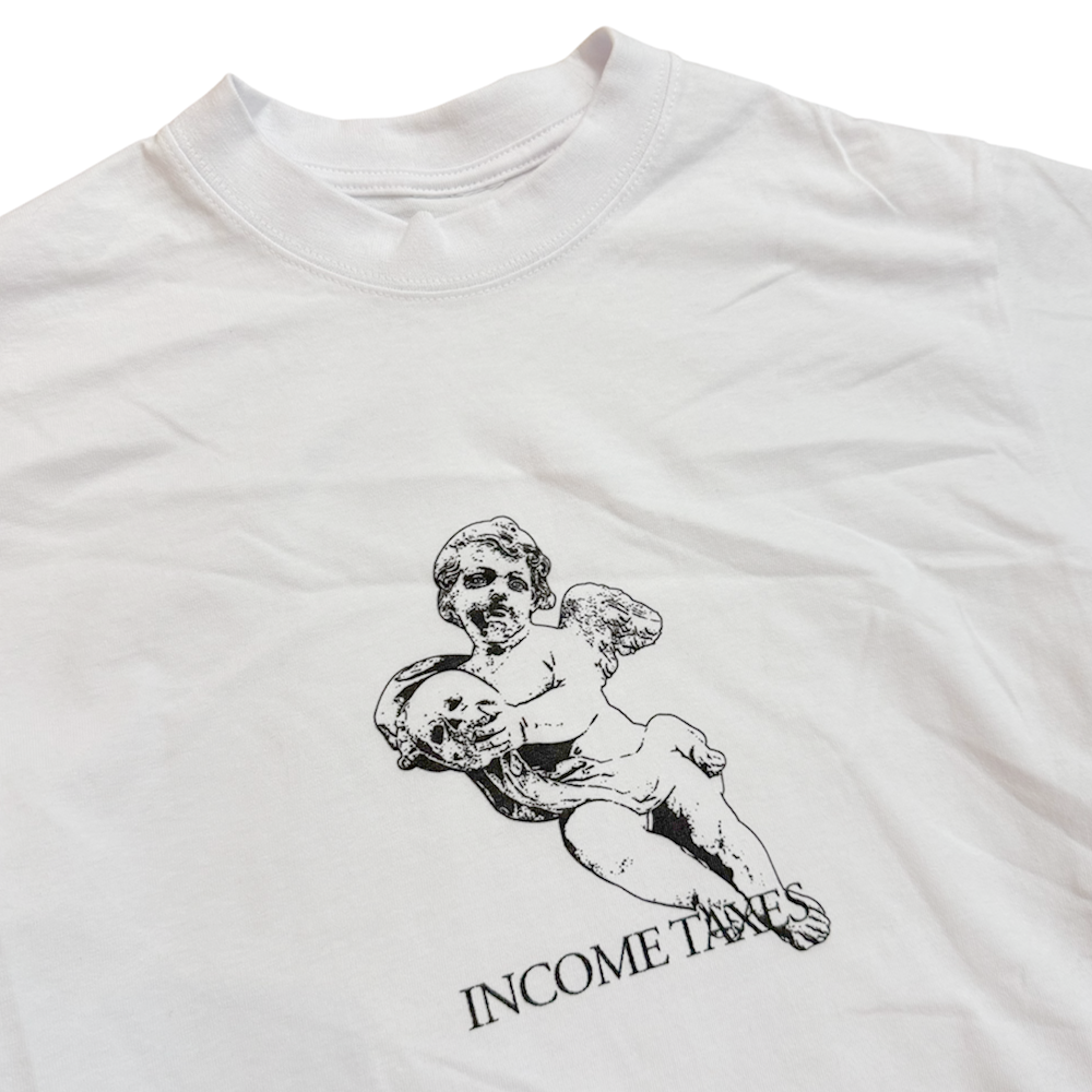 The Angel Tee White Income Taxes is a white premium USA cotton t-shirt with a black cherub sketch holding a mask and "INCOME TAXES" printed below—the perfect standout streetwear piece.