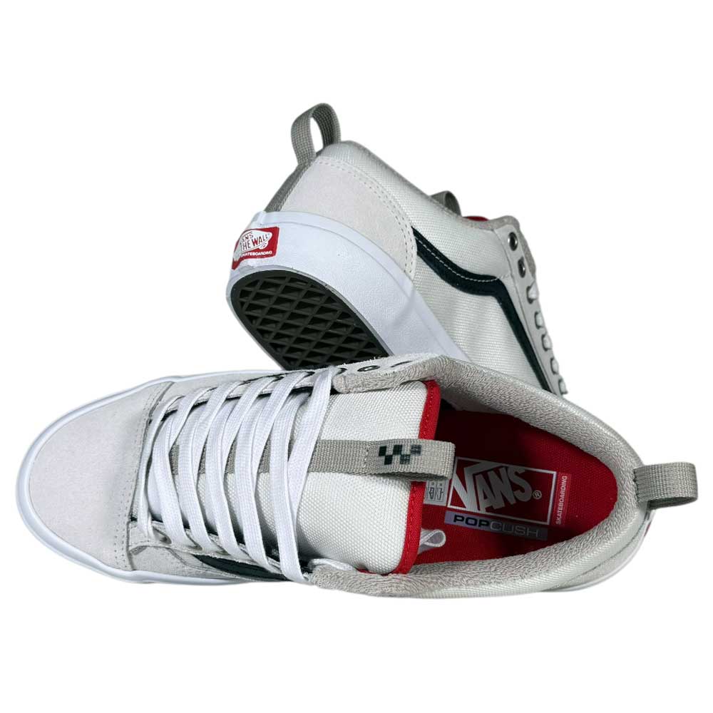 A pair of Antique White Black Skate Old Skool 36+ Vans Suede Shoes, featuring black accents, red interiors, and white laces. One shoe stands upright showing side/top views; the other is tilted to display the sole and inner branding.