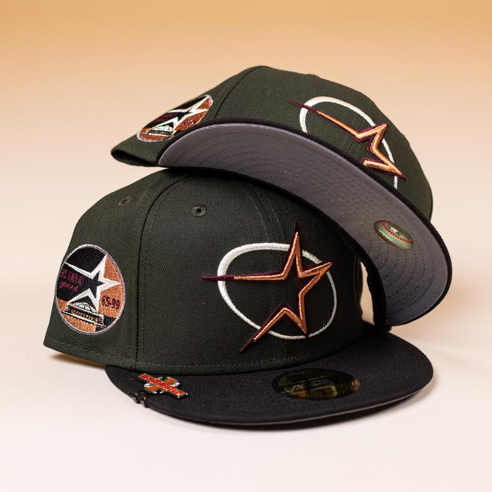Two GWOP Dark Green Burgundy Bronze Circle Star Houston Astros New Era Hat 5950 Day caps, featuring star and circular embroidery, are stacked together on a gradient beige background.