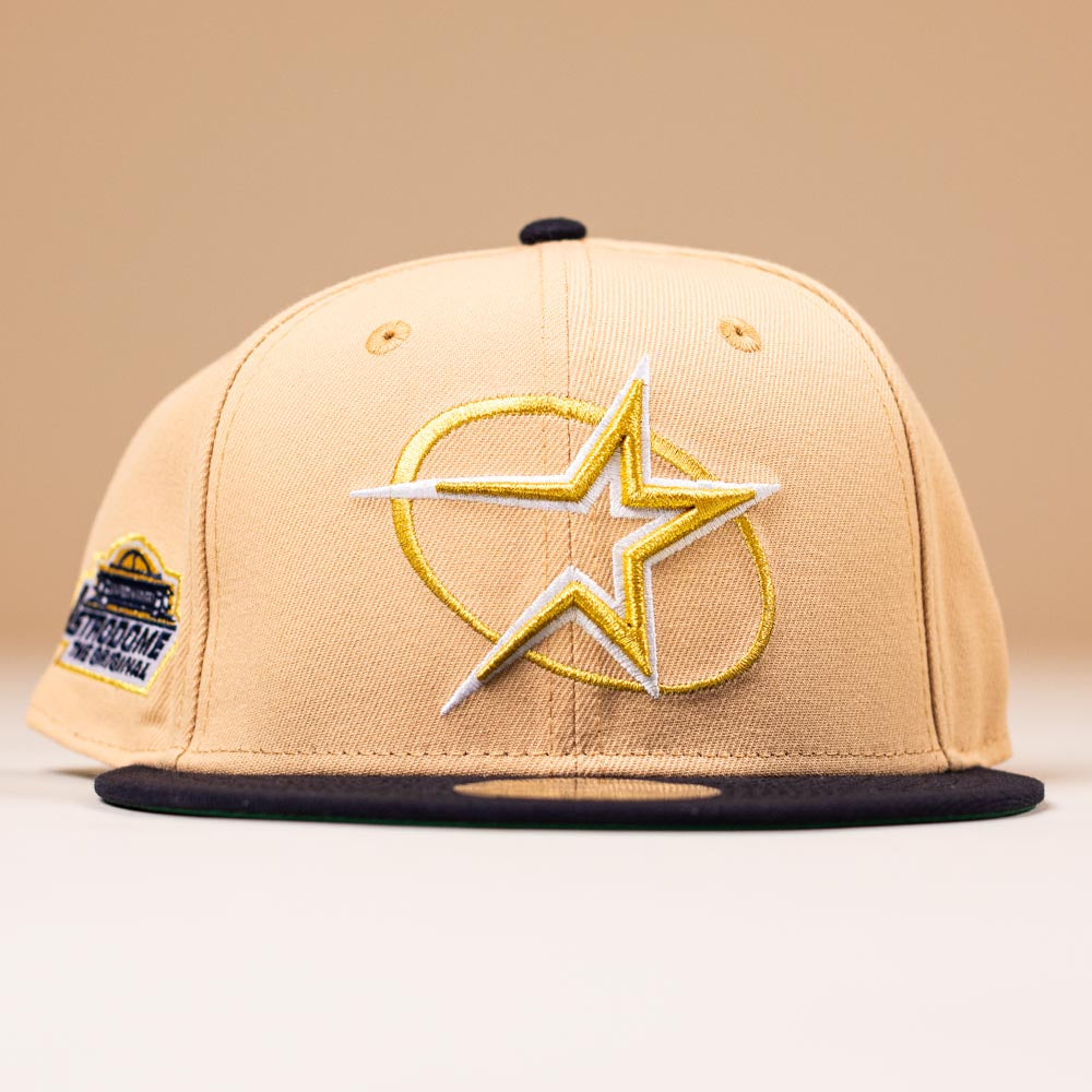 The Tan Black Circle Star Houston Astros New Era 5950 Fitted Hat features a bold circle star logo and commemorative patch—perfect for any Whatafitted collection.