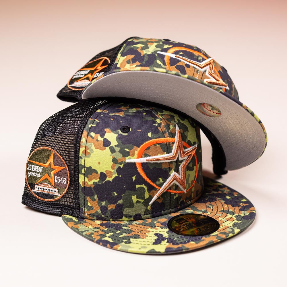 Two Fleck Black True Houston Astros New Era 5950 fitted hats are stacked, both featuring mesh backs and an orange star logo—one shows the front, the other the underside of the brim.