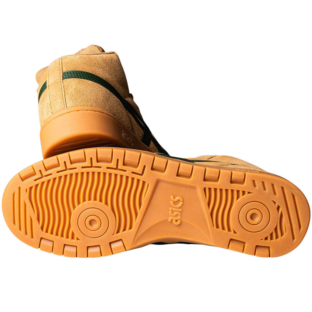 A pair of Japan Pro MT Asics Walnut Forest Night 1201B033200 suede skateboarding shoes, one showing the sole’s circular grooves, the other upright highlighting the tan upper with green stripes.