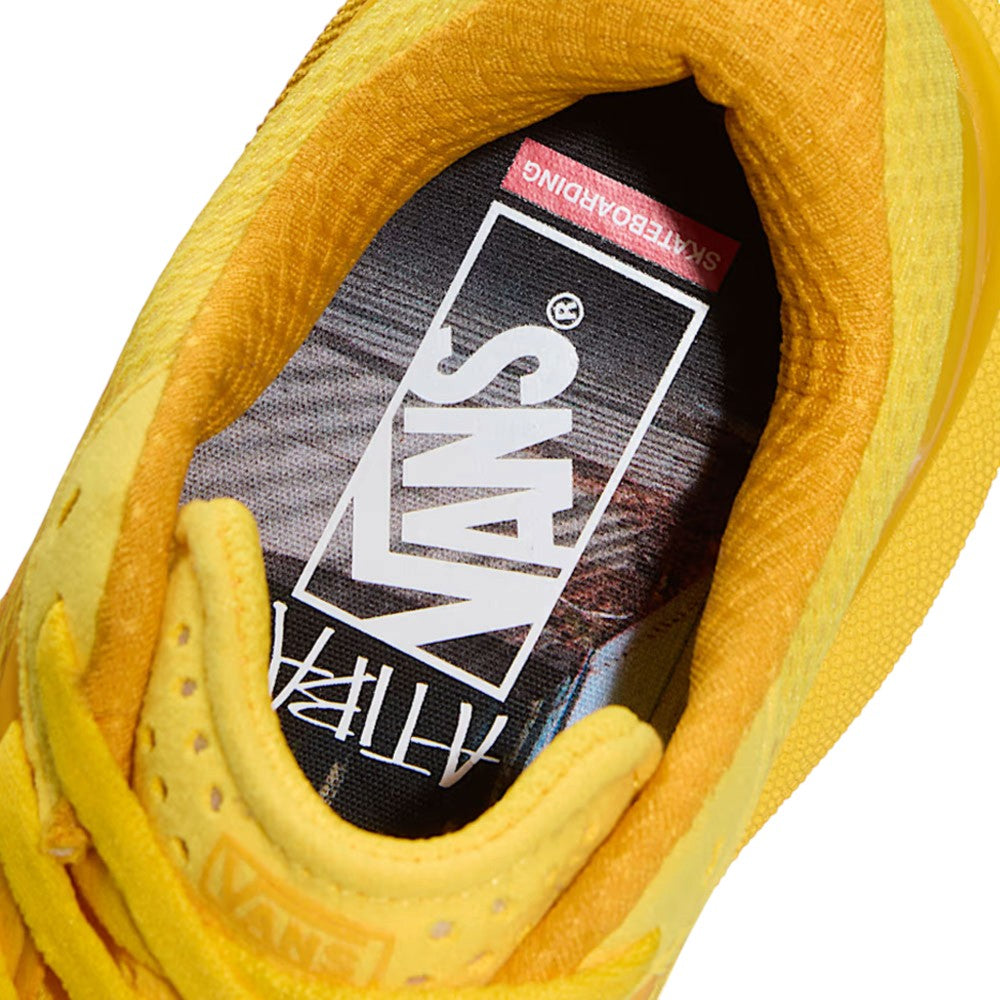 Top-down view of a golden yellow Atiba Vans AVE Rapid LX Gold VN000Y1MGLD Suede Skateboarding Shoe, highlighting the cushioned collar and branded interior insole.