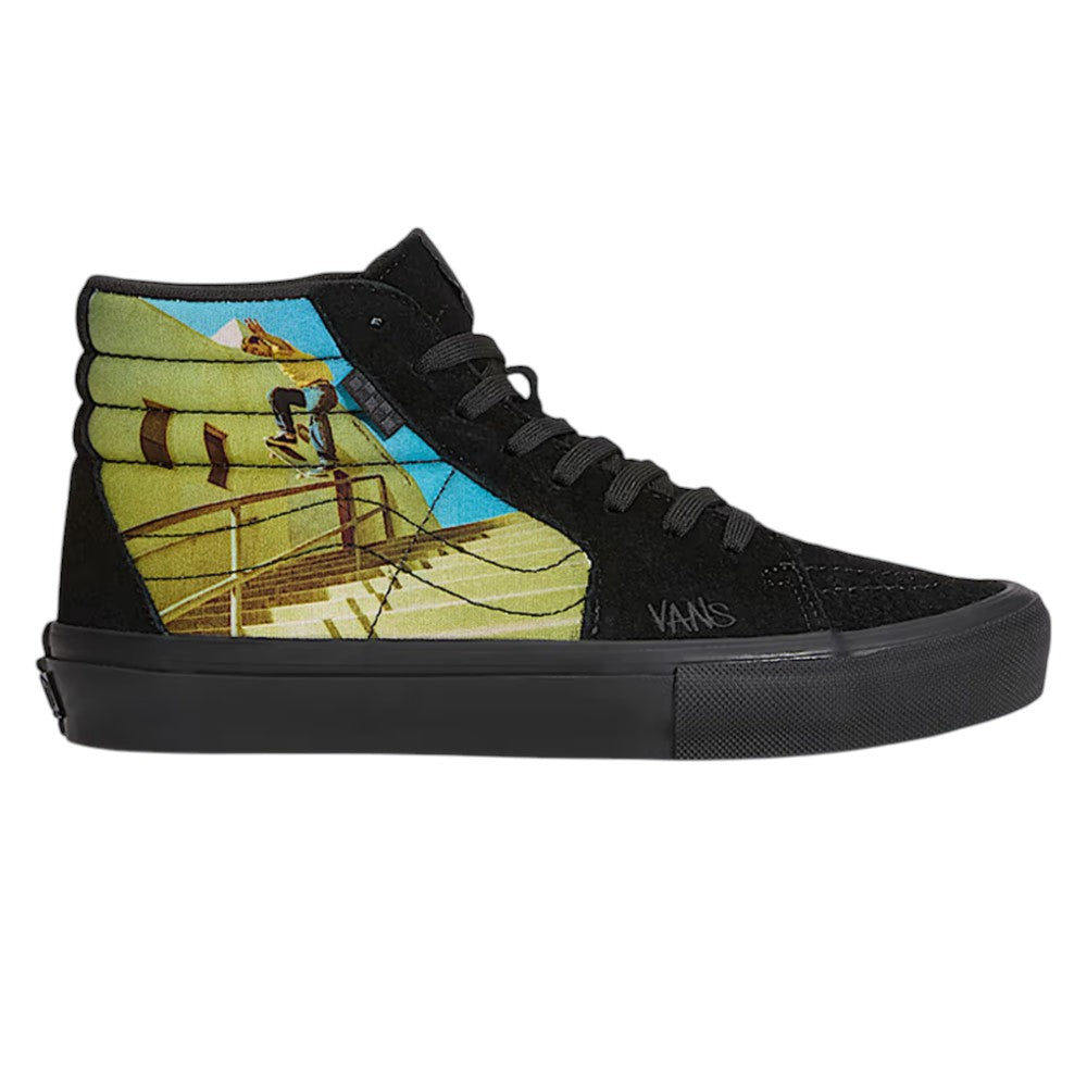 Atiba Vans Sk8 HI Black Multi VN0A5FCCBOV Suede Skateboarding Shoes high-top sneaker featuring a graphic of a person skateboarding on stairs on the side panel, enhanced with PopCush insoles for impact protection.