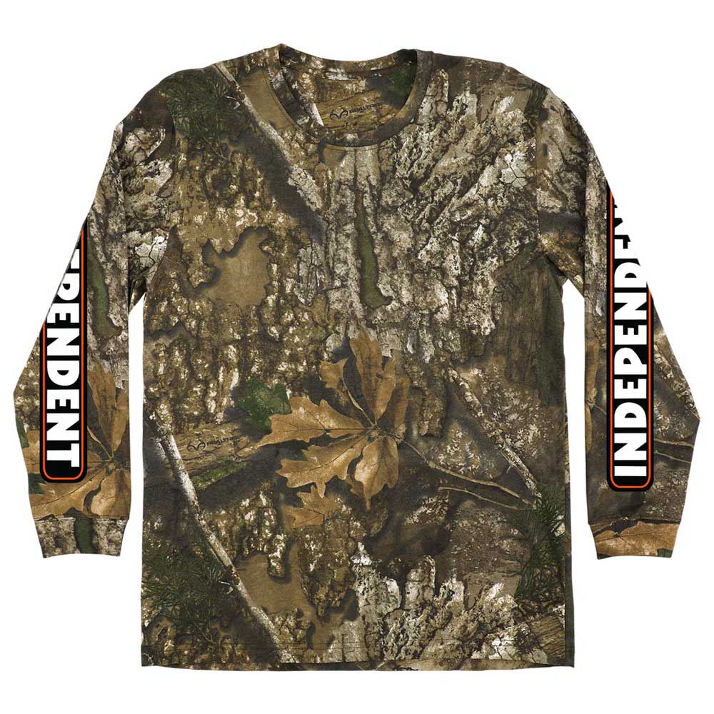 The Bar Logo Realtree APX Longsleeve Midweight T-Shirt by Independent features a realistic tree bark and leaves pattern, with "INDEPENDENT" in bold white letters outlined in black and red on both sleeves.