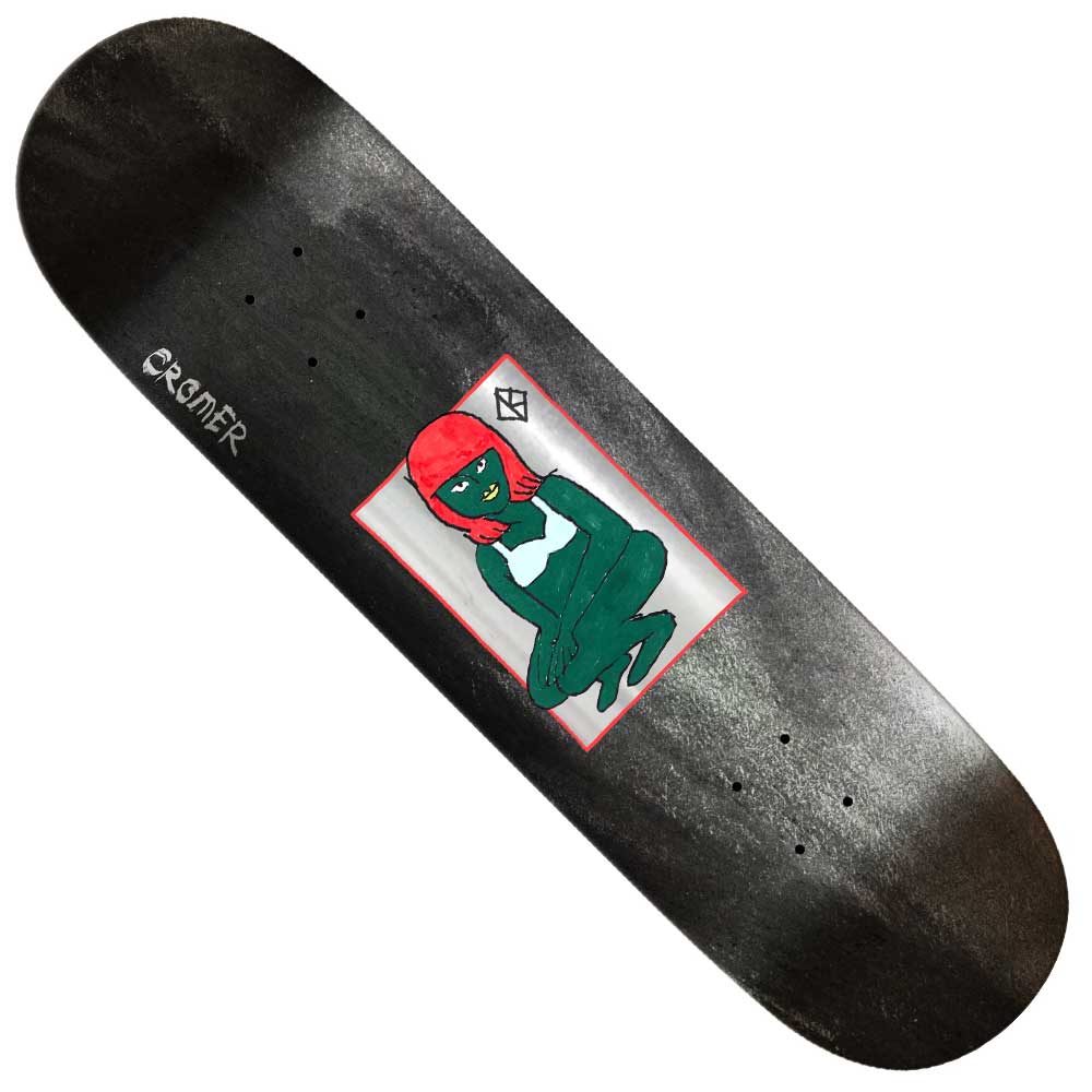 The Basalt Construction DBX 8.25x31.9 Cromer Green Lady Krooked Skateboard Deck features a black lightweight design with a green figure in a red headscarf, hands clasped, on a white square, and "CREAMER" on the left.