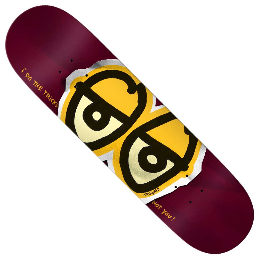 The Basalt Construction DBX 8.5x31.7 Eyes Wine Krooked Skateboard Deck features a maroon background, large stylized yellow eyes, and "I do THE tricks" and "NOT you!" in yellow, crafted with advanced basalt technology.