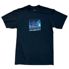 The Beemer Tee Black Income Taxes is made from premium USA cotton and features a red car cruising through a futuristic cityscape with glowing blue lights—a perfect streetwear pick for fans of bold graphics.