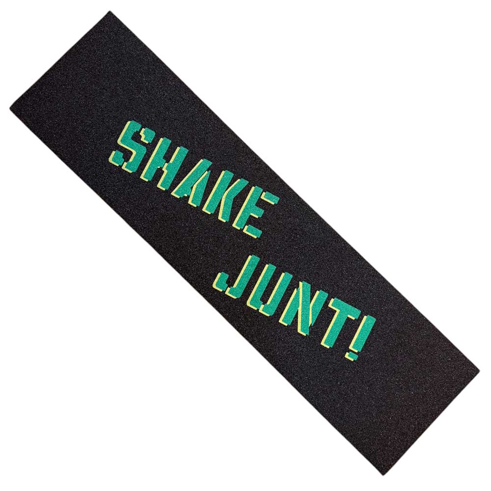 The Big Spray Shake Junt MOB Griptape in black features “SHAKE JUNT!” printed diagonally in green with yellow outline—ideal for adding signature Shake Junt style to your skateboard.