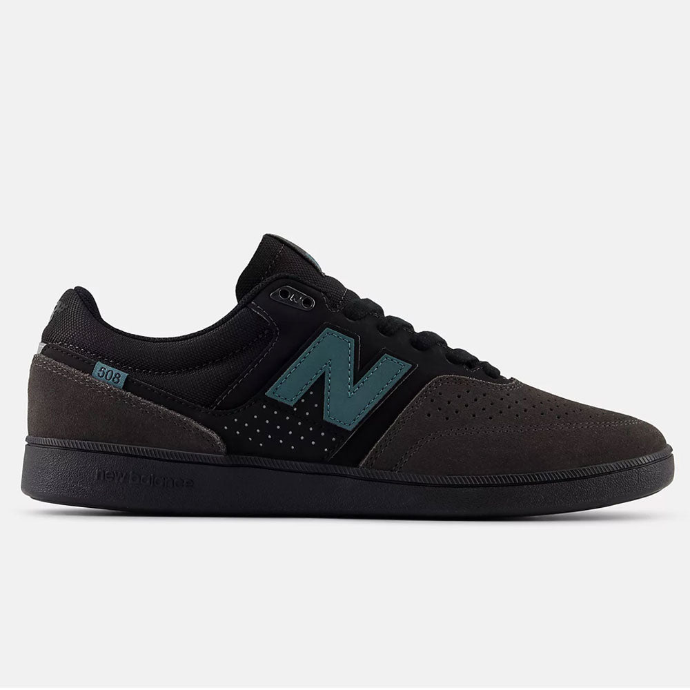 The Black Cement New Spruce 508 TAC New Balance Numeric Suede Skateboarding Shoe, created with Brandon Westgate, features a teal N logo, perforated toe, black laces and sole, all shown in side profile on a light background.