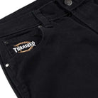 Close-up of the Black Duck Pant Thrasher Magazine x Dickies Skateboarding A88OP BLK, featuring a relaxed fit, small Thrasher flame logo patch above the front pocket, silver rivets, and classic waistband button.