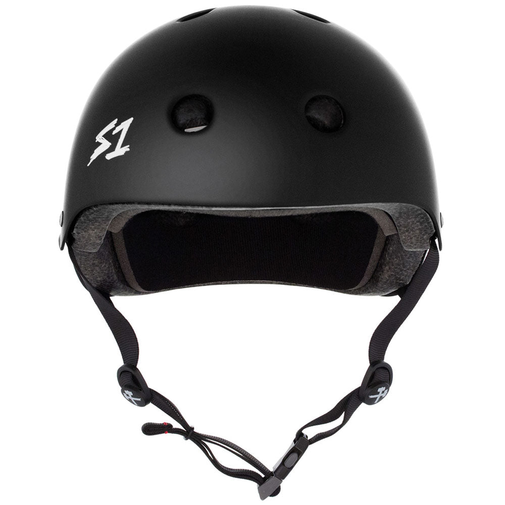 The Black Matte MEGA Lifer S1 Helmet S ONE CPSC features a matte black finish, dual certification, ventilation holes, a white S1 logo, EPS Fusion Foam padding, and an adjustable chin strap—ideal for skateboarders prioritizing safety and style.
