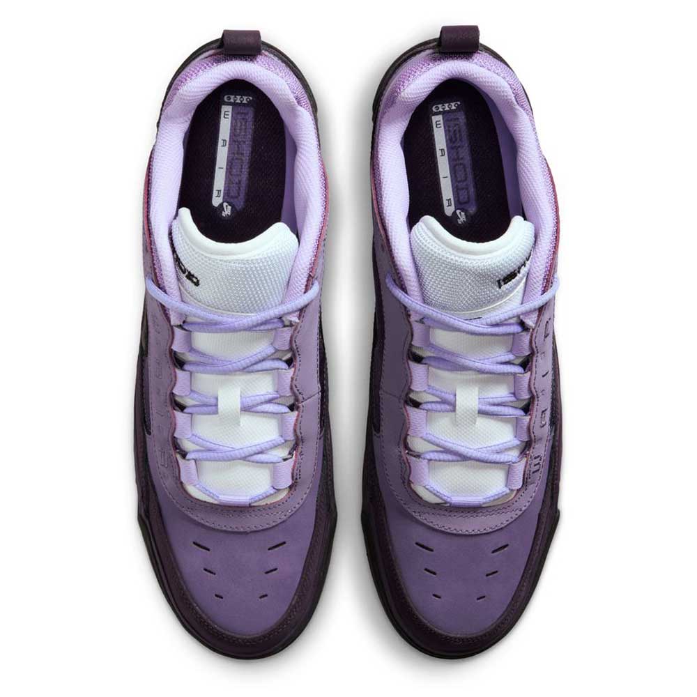 Top view of Black Noble Purple IR1887500 Air MAX Ishod Nike SB skate shoes with white tongues, light purple laces in a unique loop pattern, and light purple inner lining. Features Max Air cushioning; shoes are side by side on a white background.