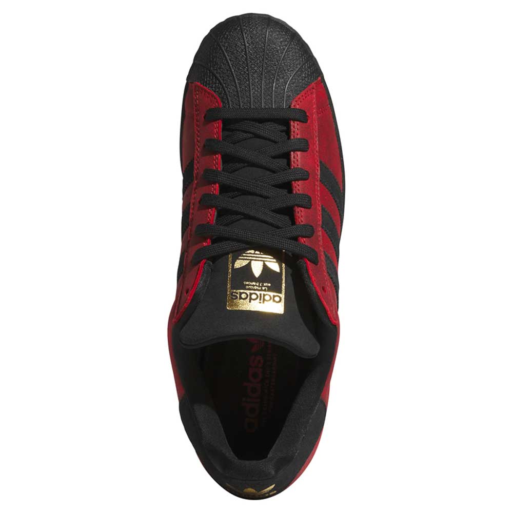 Top view of the Black Red Fog KJ5118 Superstar Adidas Skateboarding Suede Shoe featuring black laces, black stripes, and a gold adidas logo on the tongue—an iconic silhouette reimagined for style and performance on and off the board.