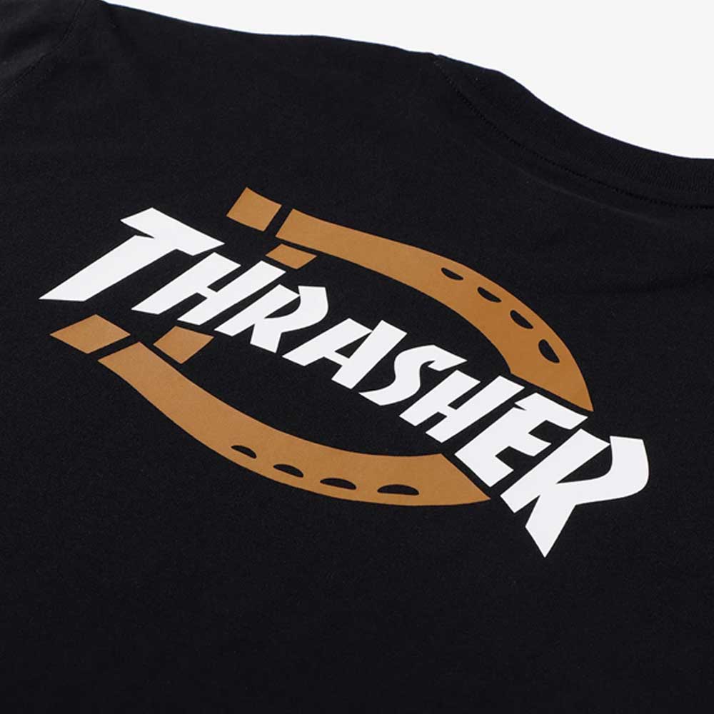 The Black Tee Thrasher Magazine x Dickies Skateboarding A88IU BLK features bold white "THRASHER" text over a brown horseshoe graphic, printed on 100% cotton. Part of the Dickies x Thrasher collection.