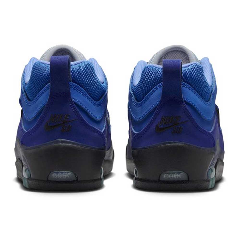 Back view of Blue Void Metallic Silver IR1887400 Air MAX Ishod Nike SB Skateboarding Shoes with black soles. Features mesh and suede uppers, Max Air cushioning on the heels, and visible Nike SB logo for comfort and style.