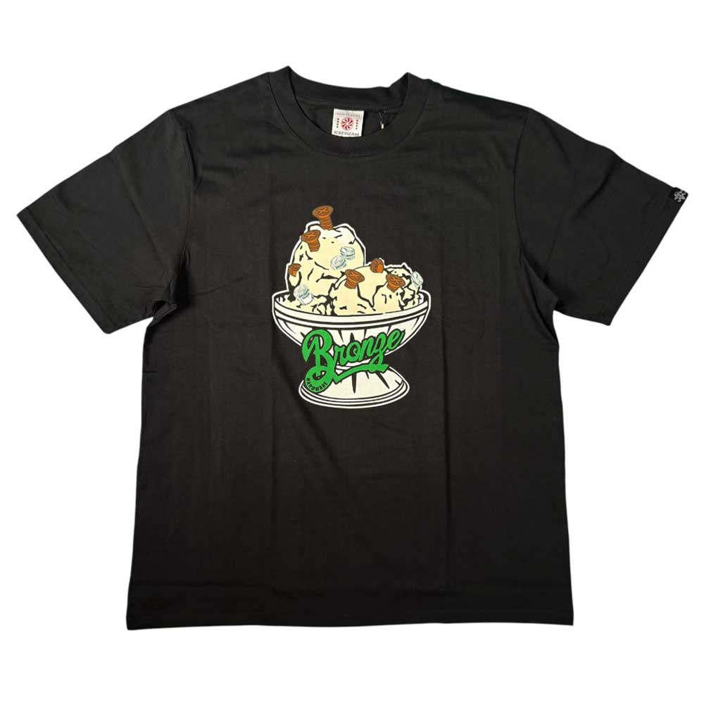 The Bronze 56K x Ice Cream 56,000 Flavors Tee Black features a graphic of an ice cream sundae with caramel sauce in a bowl and “Bronze 56K” in green stylized text on the bowl.